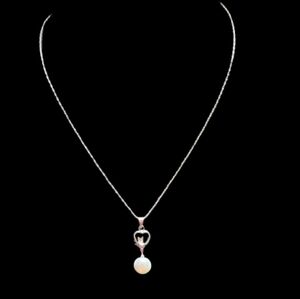 Recovered silver-toned necklace heart-shaped bail and a single faux pearl 20